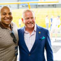 Brian Kelly smiling with a guest at the Jamie Hosford Football Center dedication.